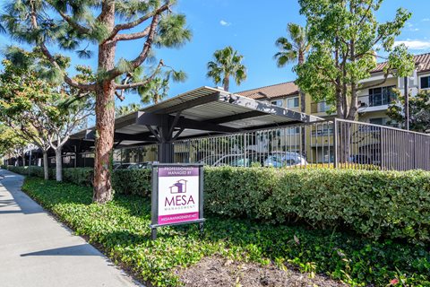 A Mesa sign is in front of a building.